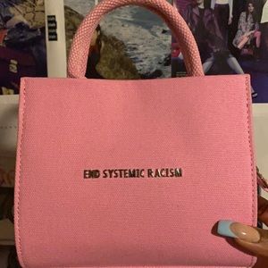 Brandon Blackwood pink “End Systemic Racism” bag